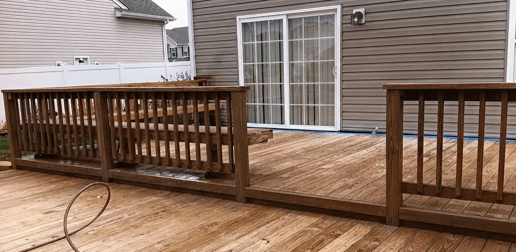 Deck sealing service protecting a backyard wood deck and railings in Allentown, PA
