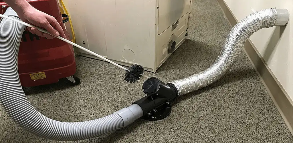 Dryer vent cleaning service removing lint from a dryer duct connection in Allentown, PA