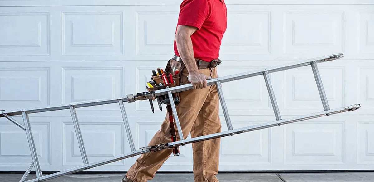 Garage door repair technician arriving with tools and ladder in Allentown, PA