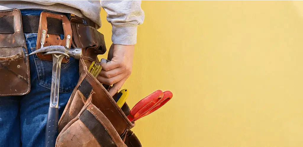 Handyman with tool belt ready for home repairs and maintenance in Allentown, PA