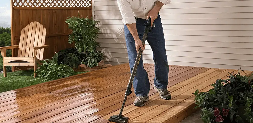 Deck staining service applying stain to a backyard wood deck in Allentown, PA